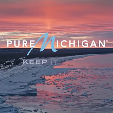 Winter landscape in Michigan with the words "Pure Michigan Keep It" written over the image.