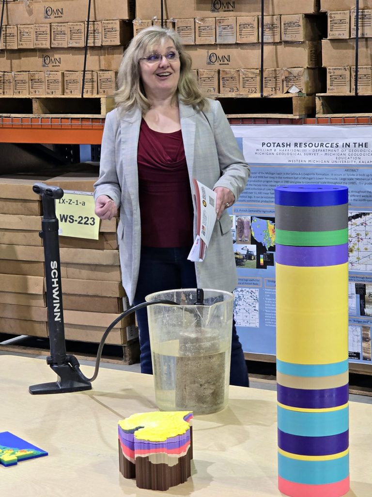 Sara Pearson shows how fluids can flow through porous rocks.