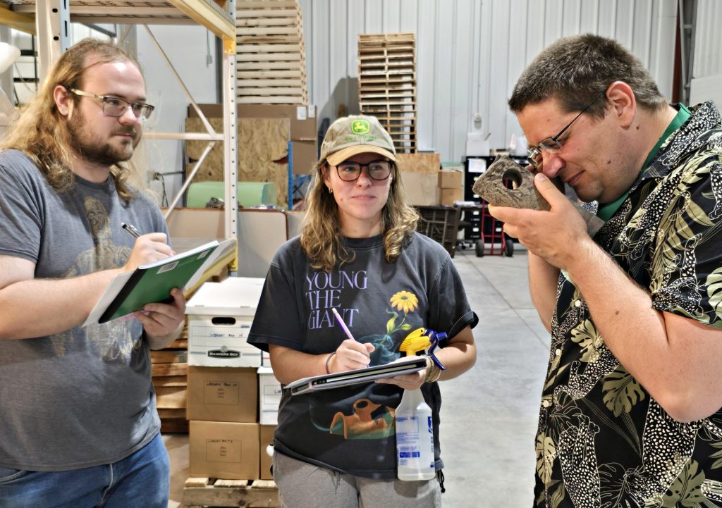 Dr. Voice and students examining core.
