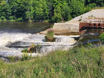 image of man made dam along river